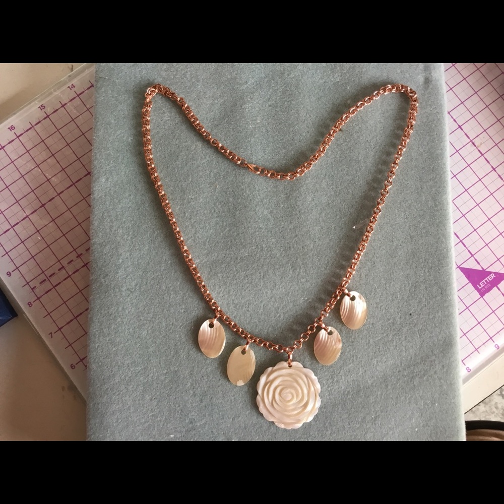 Mother of pearl on rose gold chain.